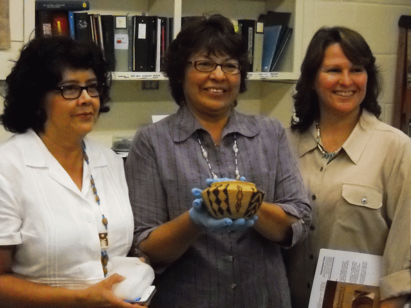 Three ladies from the Tubatulabal tribe; one holds a finely detailed basket